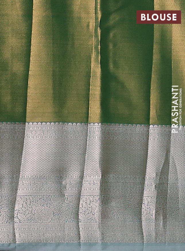 Semi kanchipuram tissue silk saree light green with allover silver zari woven brocade weaves and long zari woven border