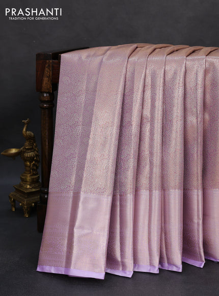 Semi kanchipuram tissue silk saree lavender with allover silver zari woven brocade weaves and long zari woven border
