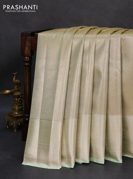 Semi kanchipuram tissue silk saree pista green with allover silver zari woven brocade weaves and zari woven border