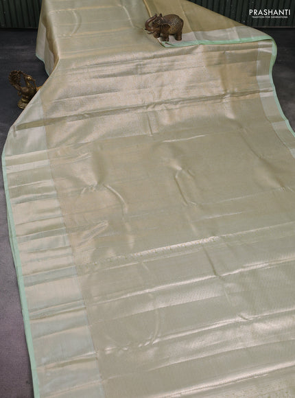 Semi kanchipuram tissue silk saree pista green with allover silver zari woven brocade weaves and zari woven border