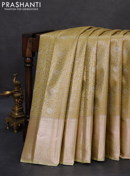 Semi kanchipuram tissue silk saree lime yellow with allover silver zari woven brocade weaves and zari woven border