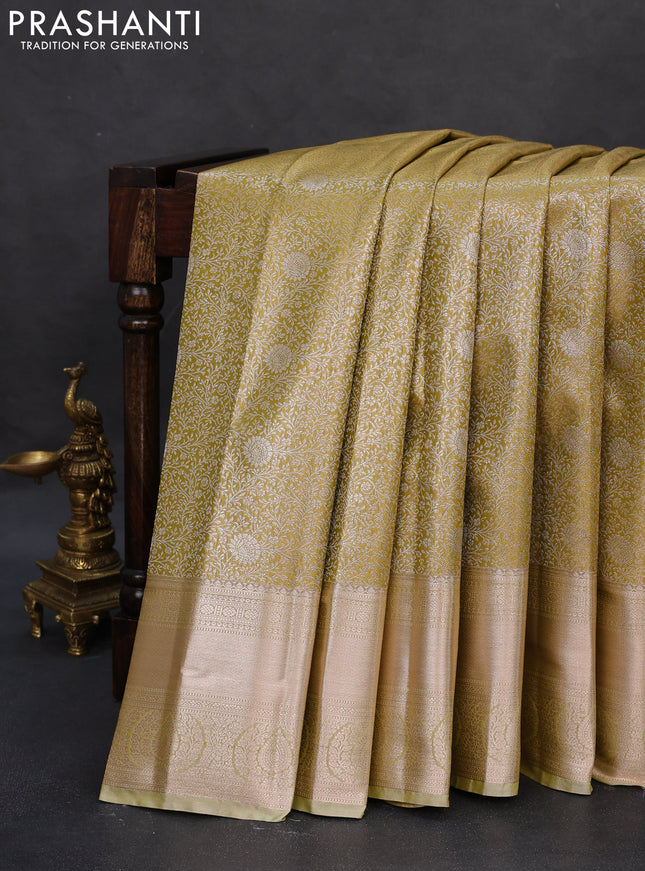 Semi kanchipuram tissue silk saree lime yellow with allover silver zari woven brocade weaves and zari woven border