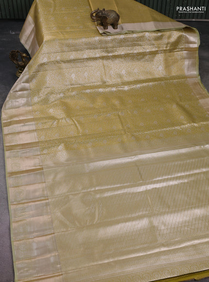Semi kanchipuram tissue silk saree lime yellow with allover silver zari woven brocade weaves and zari woven border