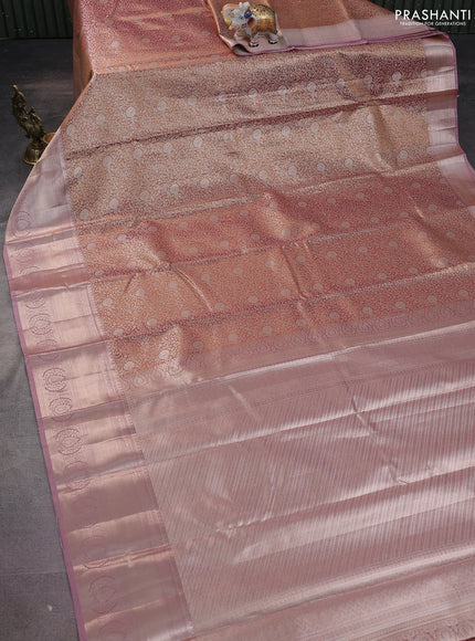 Semi kanchipuram tissue silk saree dual shade of pinkish gold and pastel pink with allover silver zari woven brocade weaves and zari woven border