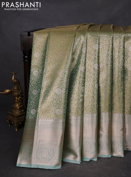 Semi kanchipuram tissue silk saree dual shade of green with allover silver zari woven brocade weaves and zari woven border