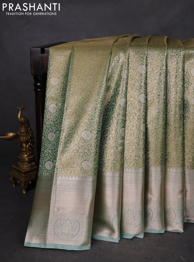 Semi kanchipuram tissue silk saree dual shade of green with allover silver zari woven brocade weaves and zari woven border