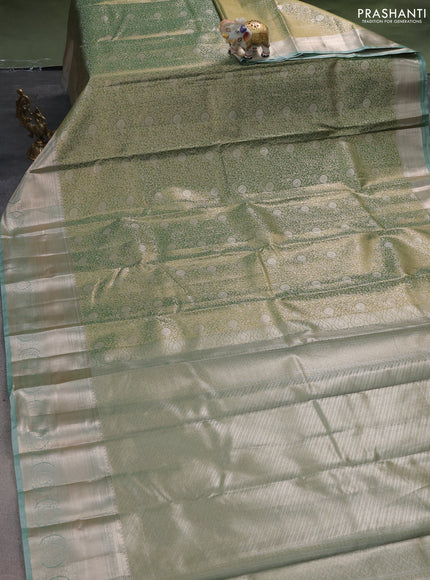 Semi kanchipuram tissue silk saree dual shade of green with allover silver zari woven brocade weaves and zari woven border
