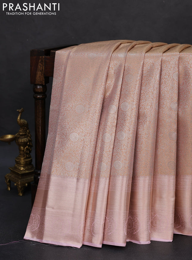 Semi kanchipuram tissue silk saree pastel peach orange and baby pink with allover silver zari woven brocade weaves and zari woven border