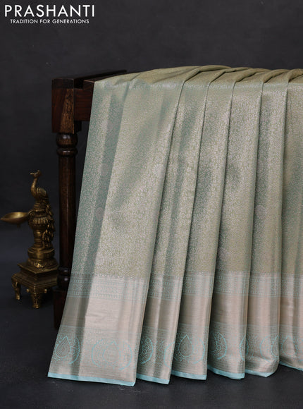 Semi kanchipuram tissue silk saree dual shade of pastel blue with allover silver zari woven brocade weaves and zari woven border