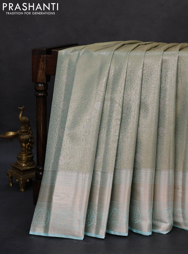 Semi kanchipuram tissue silk saree dual shade of pastel blue with allover silver zari woven brocade weaves and zari woven border
