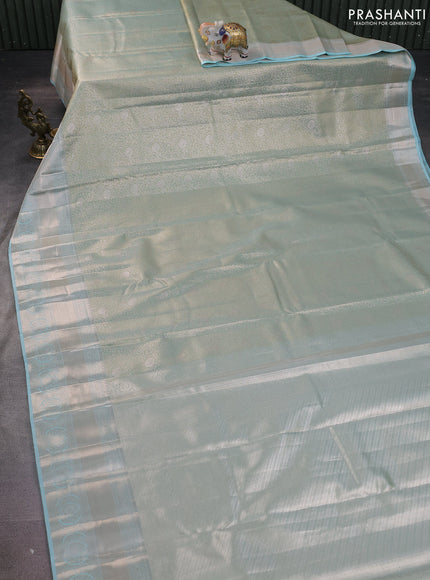 Semi kanchipuram tissue silk saree dual shade of pastel blue with allover silver zari woven brocade weaves and zari woven border