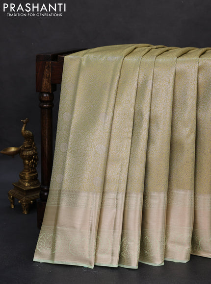Semi kanchipuram tissue silk saree pista green with allover silver zari woven brocade weaves and zari woven border