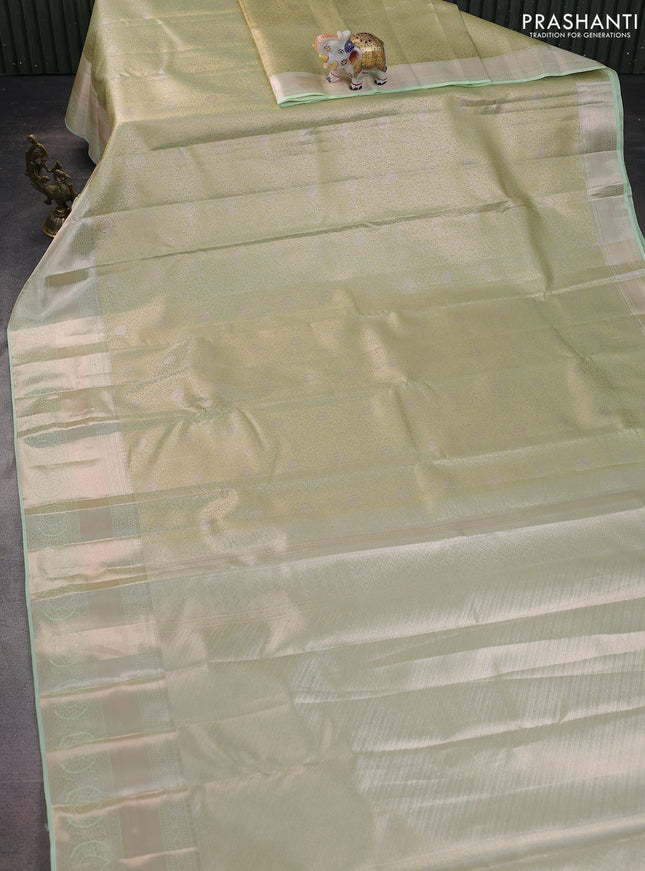 Semi kanchipuram tissue silk saree pista green with allover silver zari woven brocade weaves and zari woven border