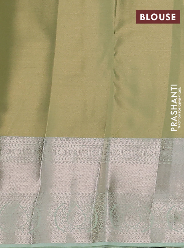 Semi kanchipuram tissue silk saree pista green with allover silver zari woven brocade weaves and zari woven border