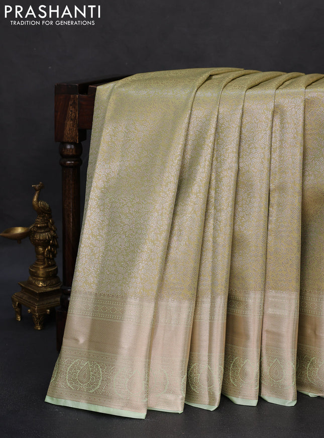 Semi kanchipuram tissue silk saree pista green with allover silver zari woven brocade weaves and zari woven border
