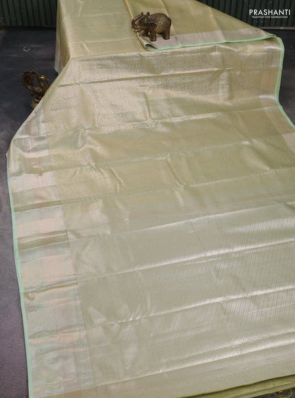 Semi kanchipuram tissue silk saree pista green with allover silver zari woven brocade weaves and zari woven border