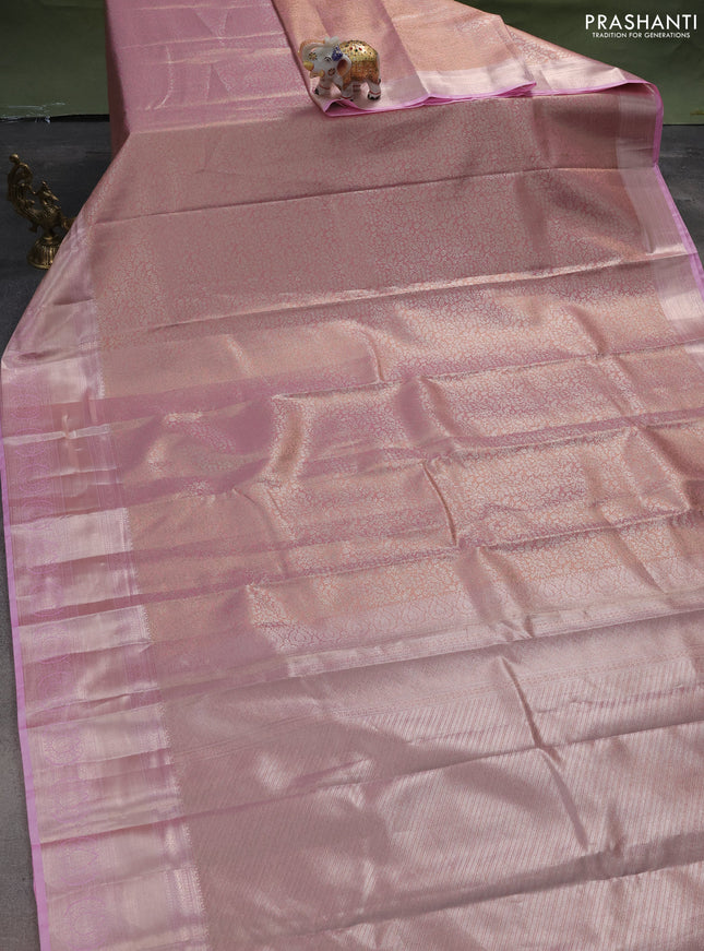 Semi kanchipuram tissue silk saree mild peach pink and light pink with allover silver zari woven brocade weaves and zari woven border