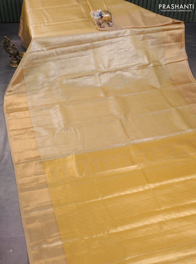 Semi kanchipuram tissue silk saree mustard yellow and sandal with allover silver zari woven brocade weaves and rich zari woven border