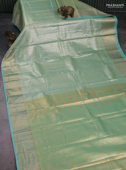 Semi kanchipuram tissue silk saree teal shade with allover silver zari woven brocade weaves and rich zari woven border