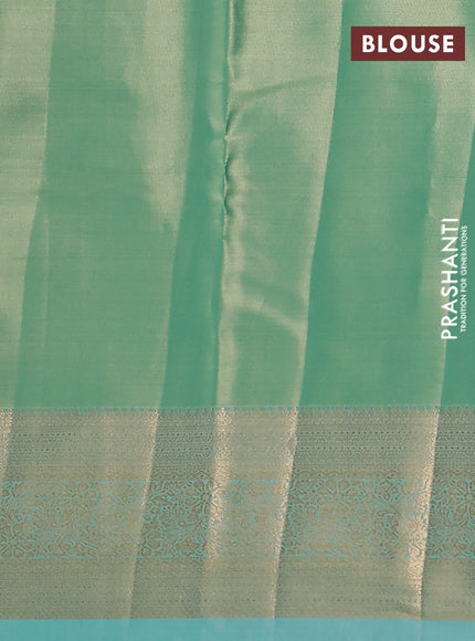 Semi kanchipuram tissue silk saree teal shade with allover silver zari woven brocade weaves and rich zari woven border