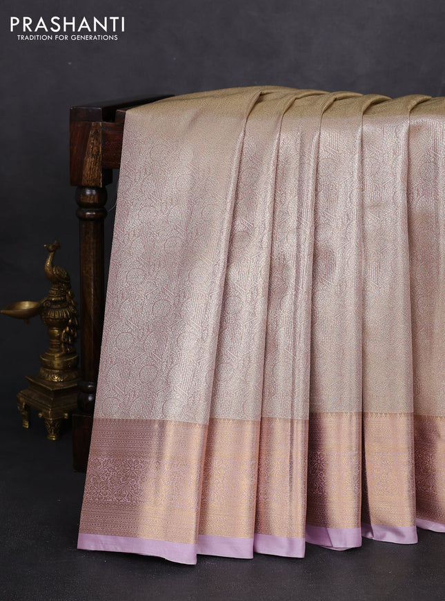Semi kanchipuram tissue silk saree beige and lavender with allover silver zari woven brocade weaves and rich zari woven border