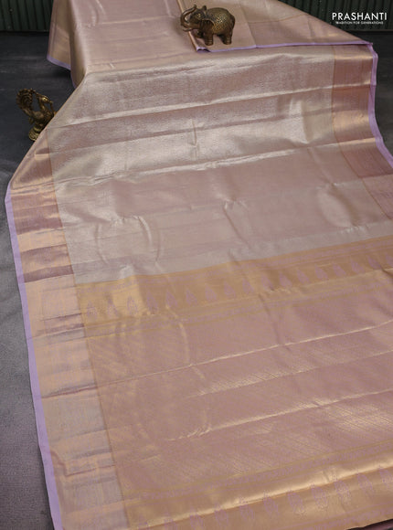 Semi kanchipuram tissue silk saree beige and lavender with allover silver zari woven brocade weaves and rich zari woven border