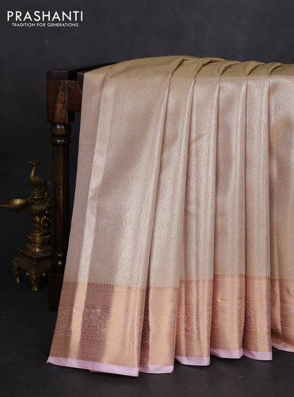 Semi kanchipuram tissue silk saree sandal and baby pink with allover silver zari woven brocade weaves and rich zari woven border