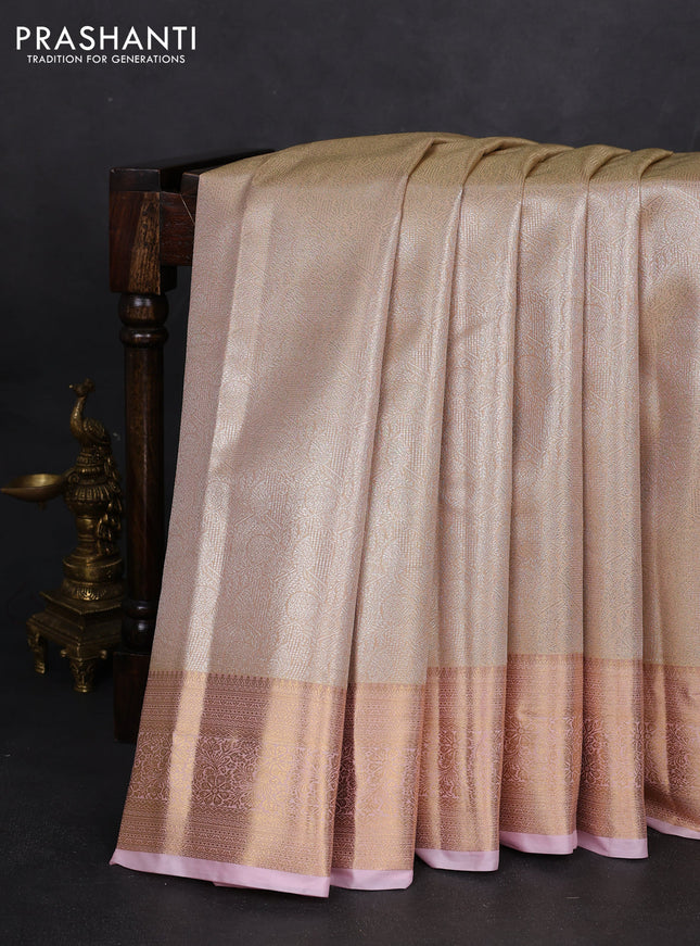 Semi kanchipuram tissue silk saree sandal and baby pink with allover silver zari woven brocade weaves and rich zari woven border