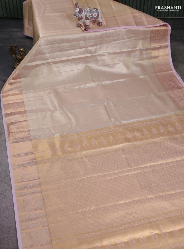 Semi kanchipuram tissue silk saree sandal and baby pink with allover silver zari woven brocade weaves and rich zari woven border