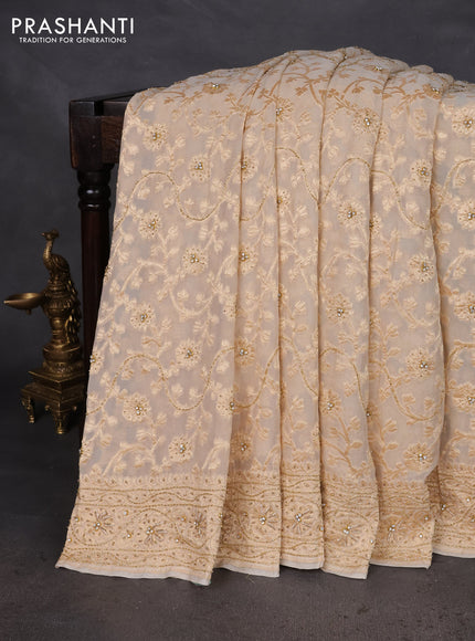 Banarasi georgette saree off white with allover jaal weaves & stone work and zardosi work border