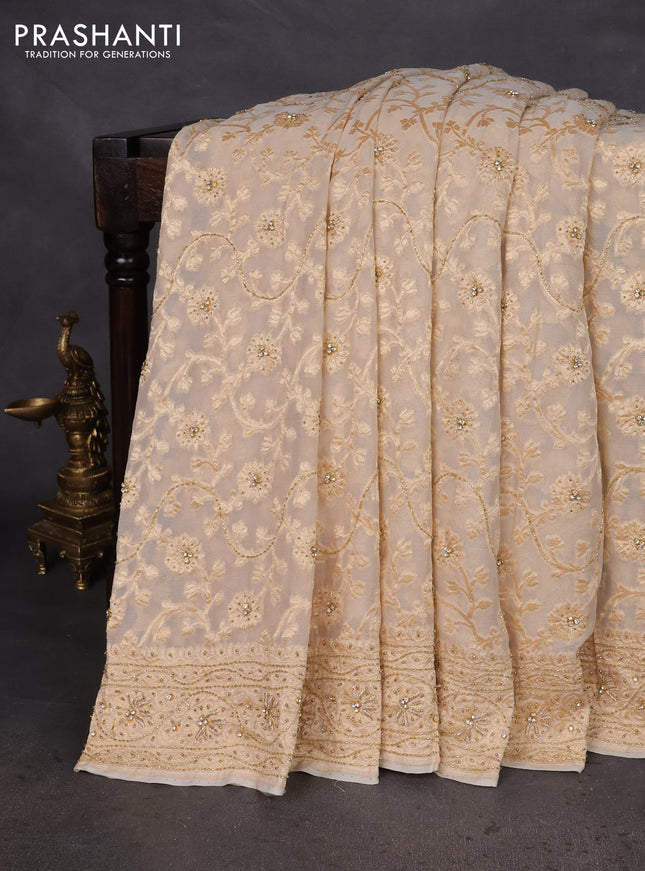 Banarasi georgette saree off white with allover jaal weaves & stone work and zardosi work border