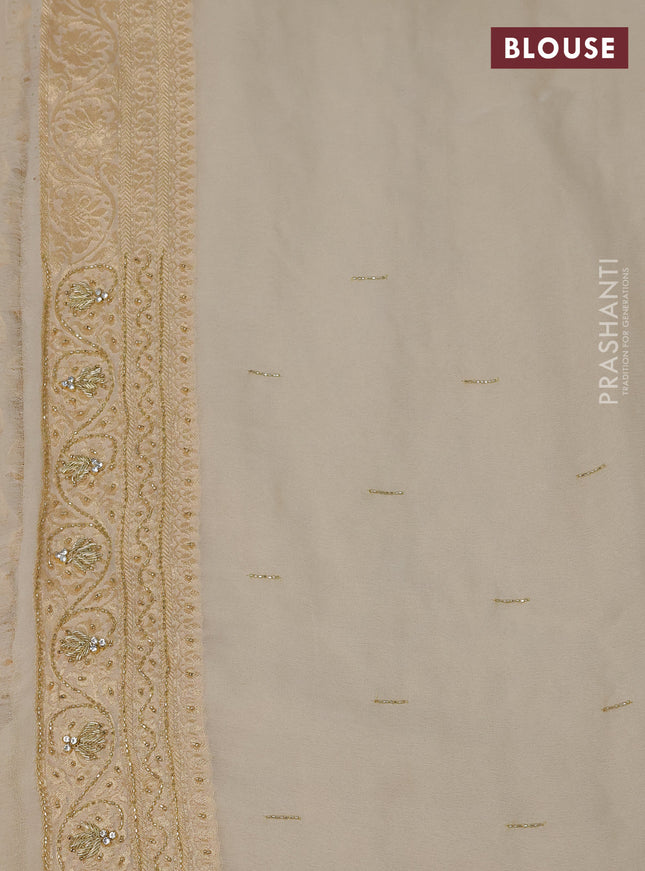 Banarasi georgette saree cream with woven buttas & stone work and zardosi work border