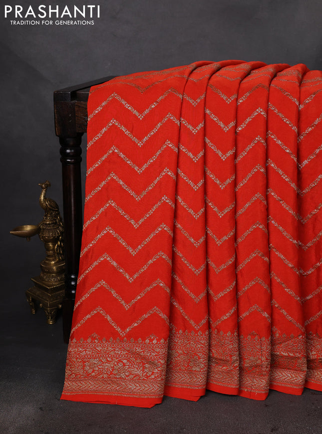 Banarasi crepe saree orange with half & half style and woven border