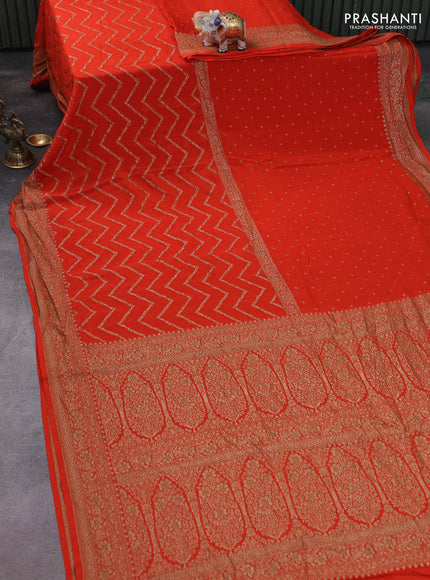 Banarasi crepe saree orange with half & half style and woven border