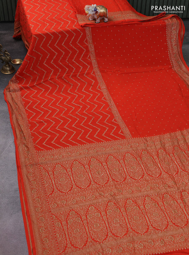 Banarasi crepe saree orange with half & half style and woven border