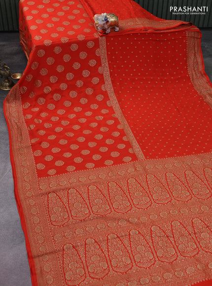 Banarasi crepe saree orange with half & half style and woven border