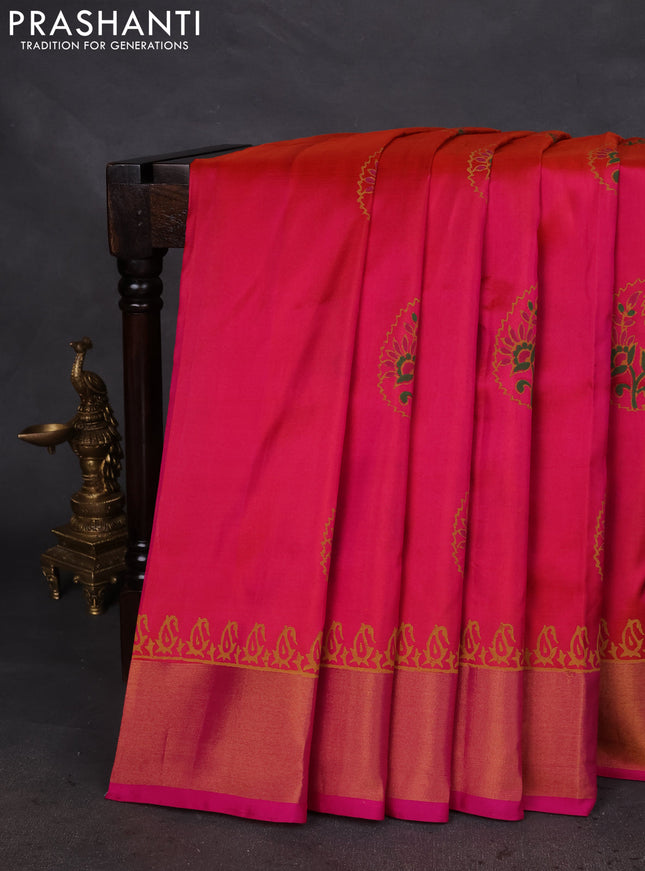 Uppada block printed silk saree dual shade of pinkish orange and pink with butta prints and zari woven border