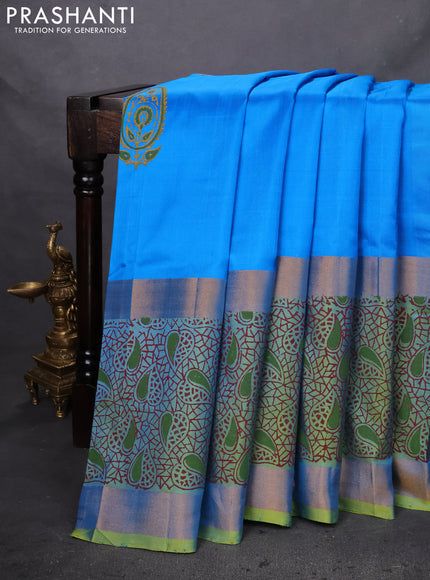 Uppada block printed silk saree cs blue and dual shade of light green with paisley butta prints and long zari woven printed border