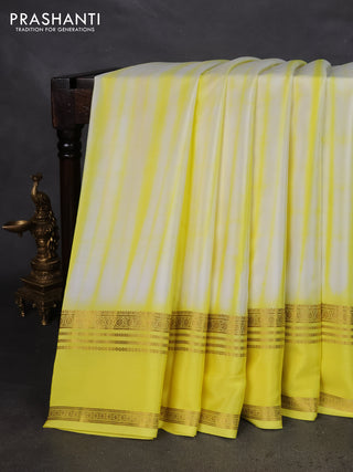 Pure mysore silk saree off white and yellow with allover shibori prints and rettapet zari woven border