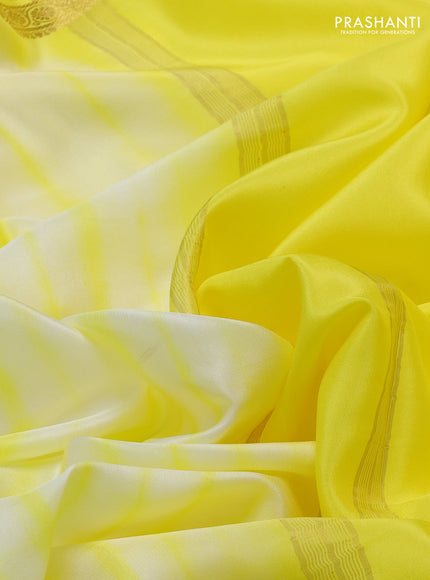 Pure mysore silk saree off white and yellow with allover shibori prints and rettapet zari woven border