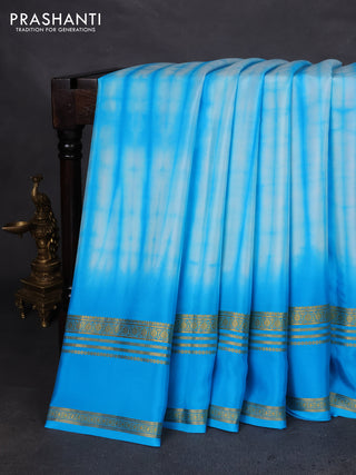 Pure mysore silk saree teal blue with allover shibori prints and rettapet zari woven border