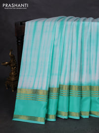 Pure mysore silk saree off white and teal green with allover shibori prints and rettapet zari woven border