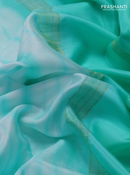 Pure mysore silk saree off white and teal green with allover shibori prints and rettapet zari woven border