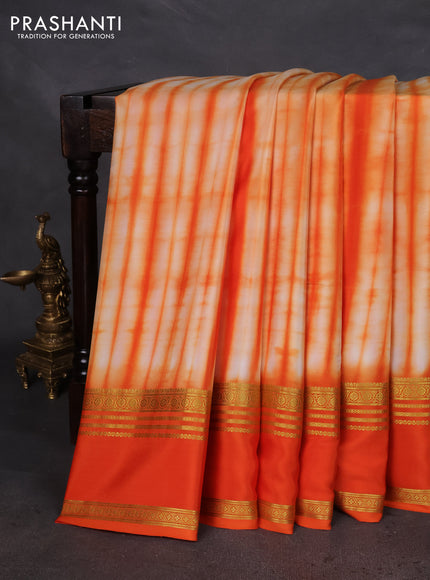 Pure mysore silk saree pale orange and orange with allover shibori prints and rettapet zari woven border