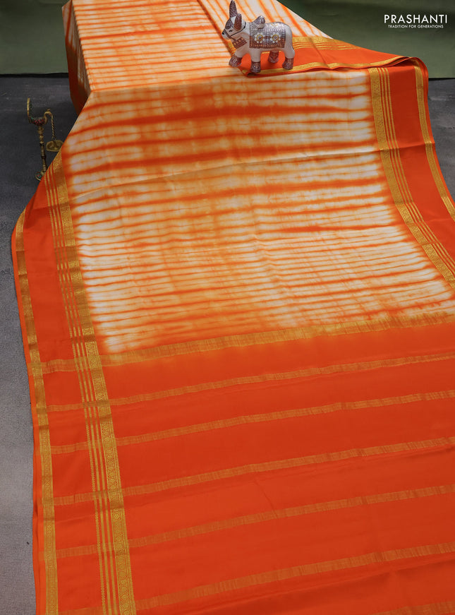 Pure mysore silk saree pale orange and orange with allover shibori prints and rettapet zari woven border