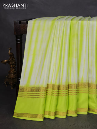 Pure mysore silk saree off white and fluorescent green with allover shibori prints and rettapet zari woven border