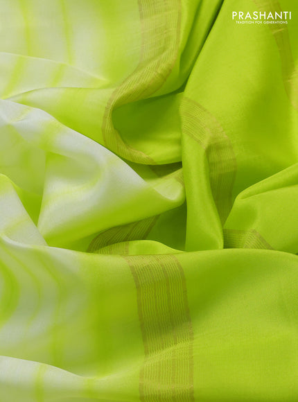 Pure mysore silk saree off white and fluorescent green with allover shibori prints and rettapet zari woven border