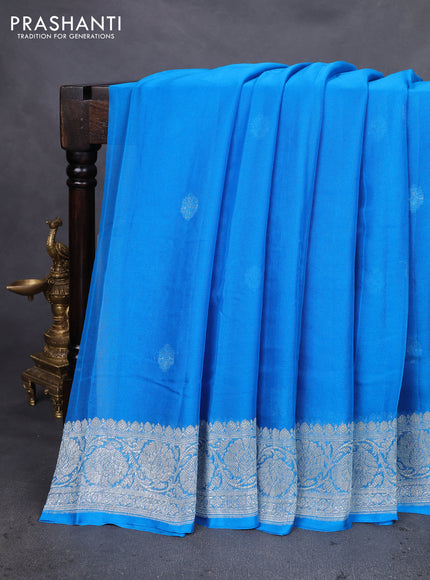 Banarasi chiffon silk saree cs blue with silver zari woven buttas and silver zari woven floral border