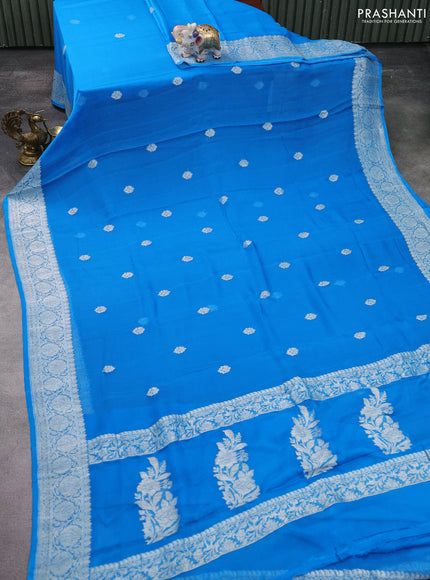 Banarasi chiffon silk saree cs blue with silver zari woven buttas and silver zari woven floral border