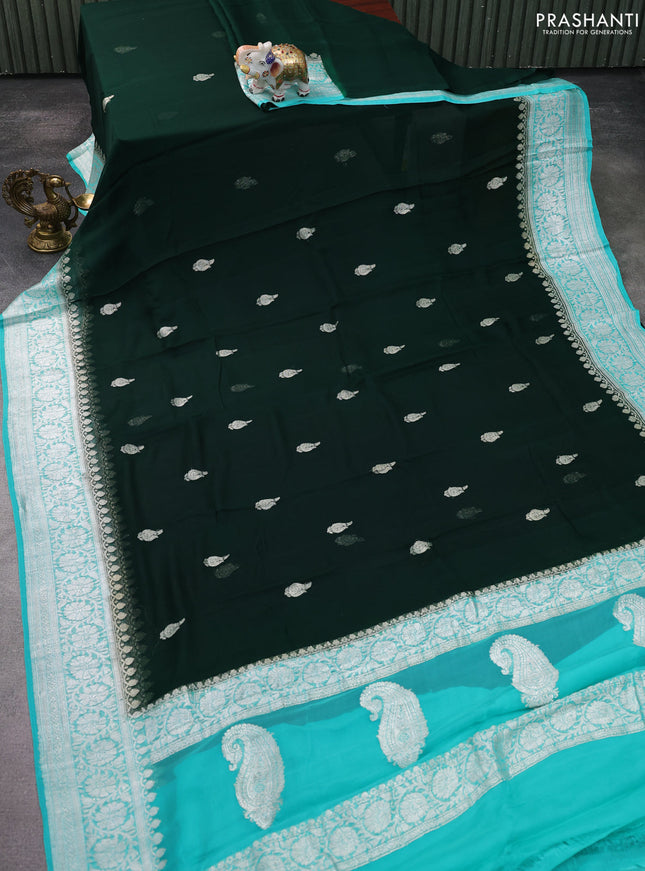 Banarasi chiffon silk saree bottle green and teal green shade with silver zari woven buttas and silver zari woven floral border